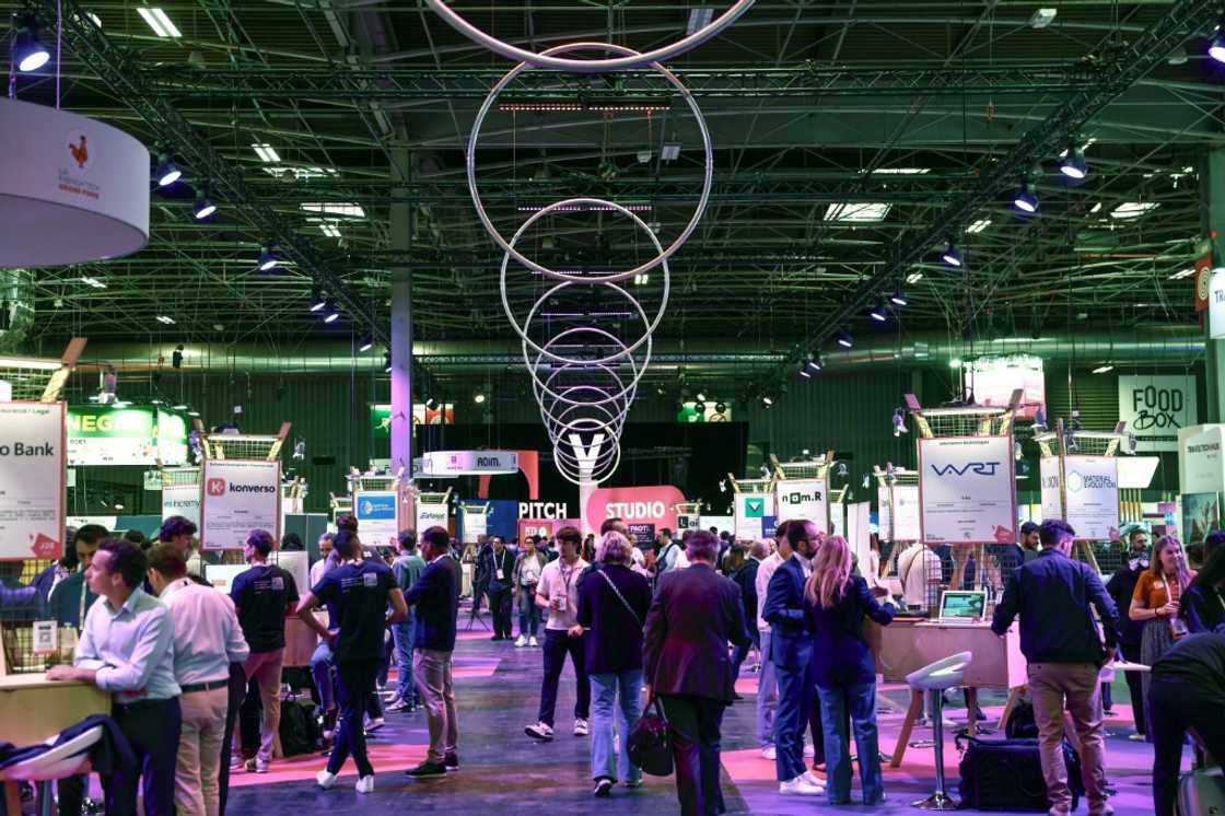 Visitors browse through the stands at the VivaTech technology fair at the Paris Expo Porte de Versailles