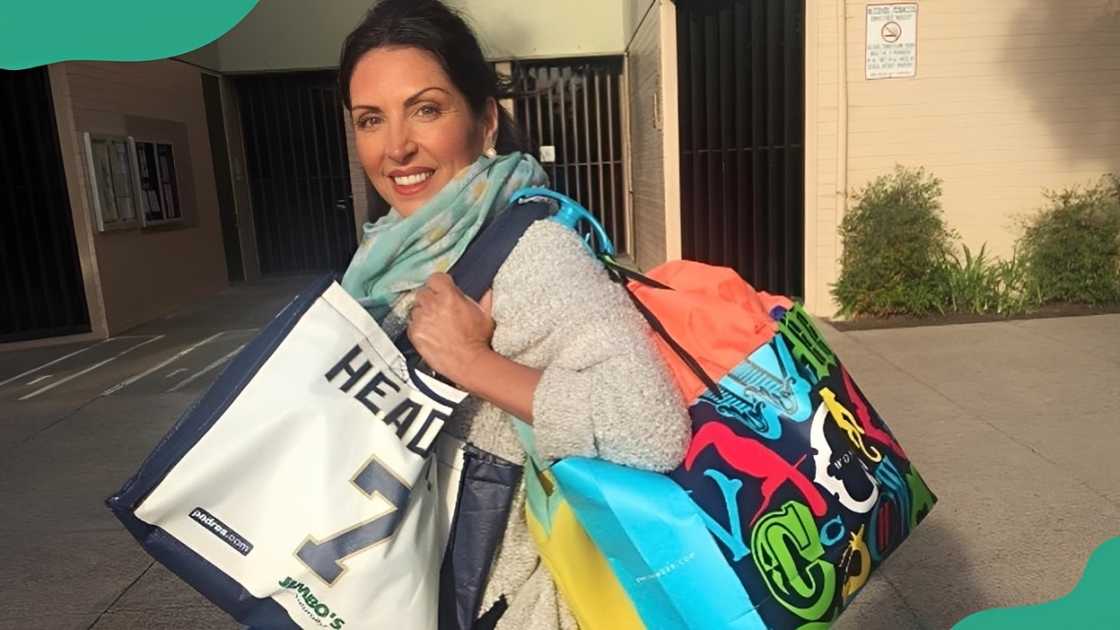 A woman showcasing Click and Carry bags. A woman showcasing Click and Carry bags.