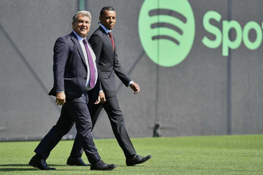 Joan Laporta introduced Jules Kounde as a Barcelona player and said the club had continued its drive to raise cash by selling a stake in media arm Barca Studio Joan Laporta introduced Jules Kounde as a Barcelona player and said the club had continued its drive to raise cash by selling a stake in media arm Barca Studio