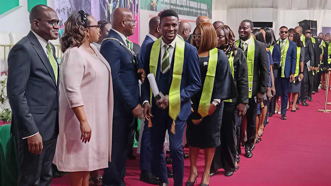 Chartered bankers in graduation gowns during their induction ceremony Chartered bankers in graduation gowns during their induction ceremony