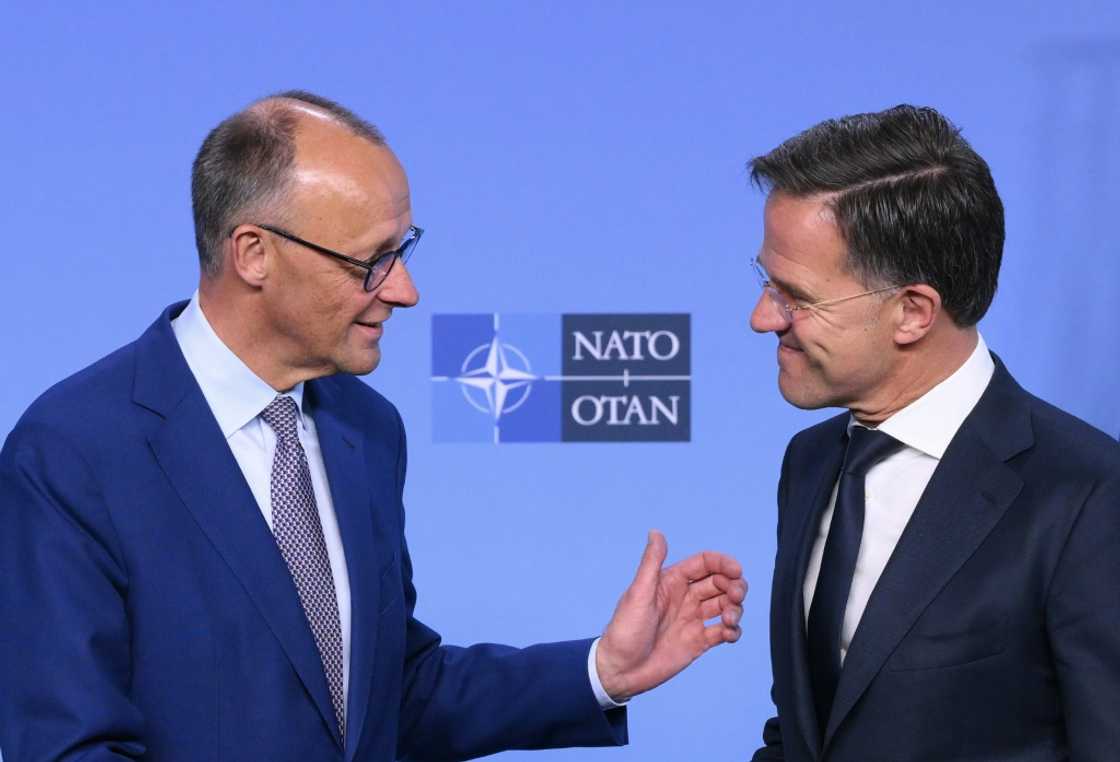 German Chancellor Friedrich Merz, left, with NATO chief Mark Rutte at the alliance headquarters on Friday German Chancellor Friedrich Merz, left, with NATO chief Mark Rutte at the alliance headquarters on Friday