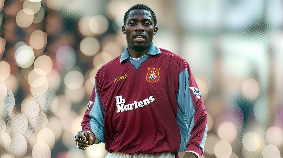Marc-Vivien Foé runs on the field in a West Ham kit. Marc-Vivien Foé runs on the field in a West Ham kit.