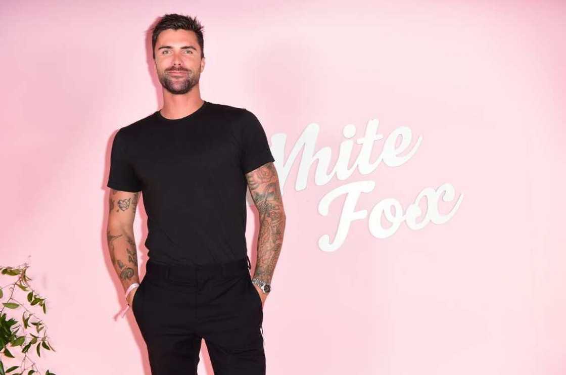 Tyler Stanaland posing for a photo in a black outfit Tyler Stanaland posing for a photo in a black outfit