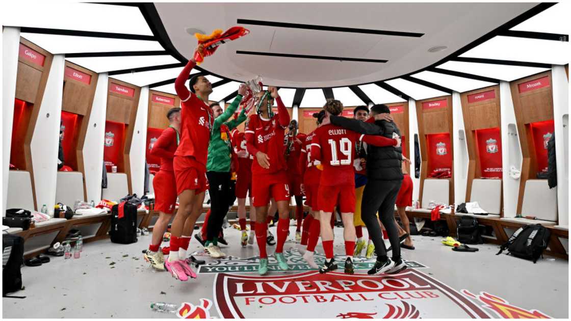 Liverpool players with the Carabao Cup in the dressing room after the Carabao Cup Final between Chelsea and Liverpool at Wembley Stadium. Photo by Andrew Powell.