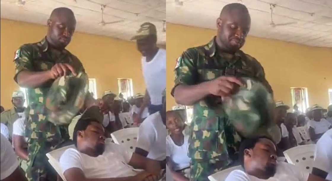 Photos of a soldier fanning an NYSC member. Photos of a soldier fanning an NYSC member.