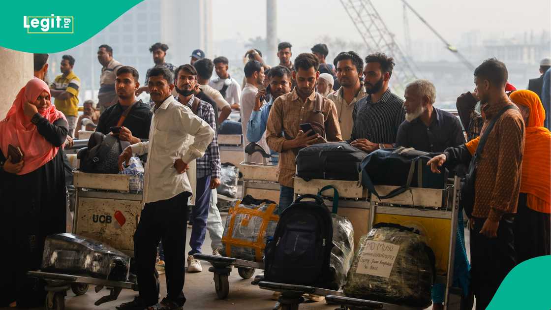 Travellers present passports at immigration counters while exiting the Middle East. Travellers present passports at immigration counters while exiting the Middle East.