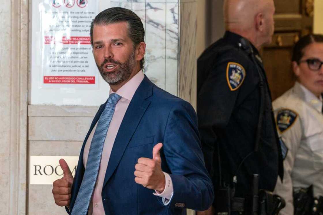 Donald Trump Jr gives a double thumbs-up during a break in his testimony Donald Trump Jr gives a double thumbs-up during a break in his testimony