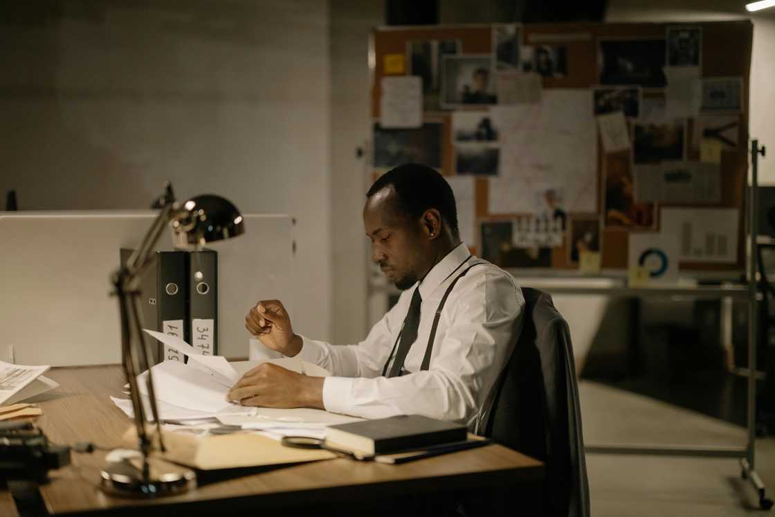 A detective checking documents A detective checking documents