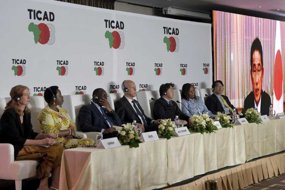 Japan's Prime Minister Fumio Kishida joins by video conference a press conference at the Tokyo International Conference on African Development (TICAD) in Tunisia