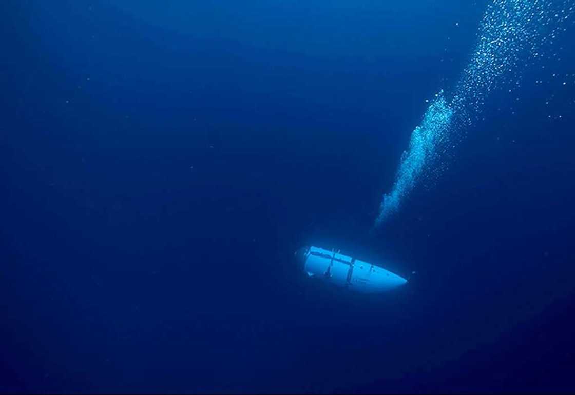 OceanGate, which operated the Titan sub (pictured here during an undated descent) before it imploded last month, said it is suspending all expeditions