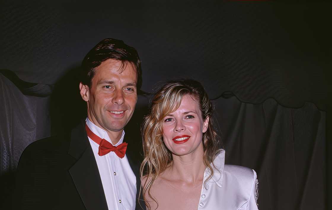 Kim Basinger and her brother, Mick Basinger pose at the 62nd Academy Awards