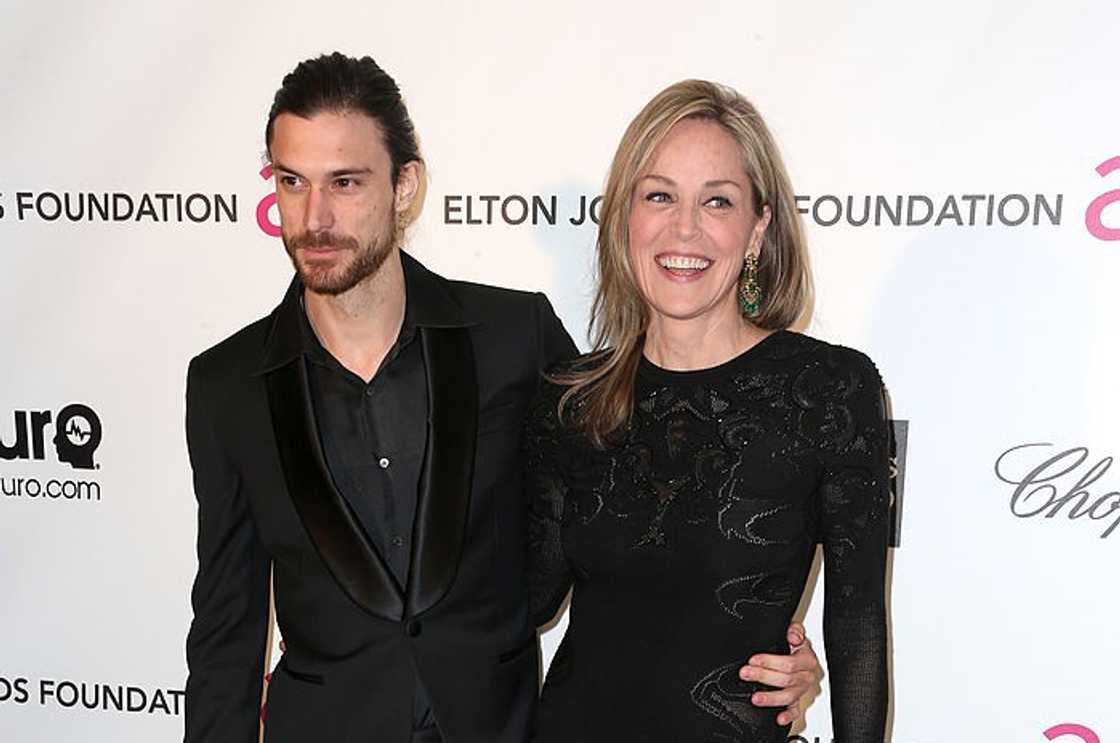 Sharon Stone (R) and model Martin Mica (L) pose in all black Sharon Stone (R) and model Martin Mica (L) pose in all black