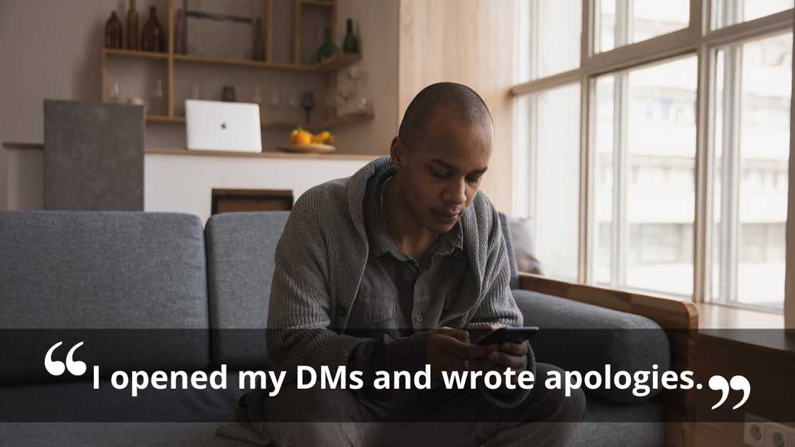 A man looking down at his phone with a serious expression. A man looking down at his phone with a serious expression.