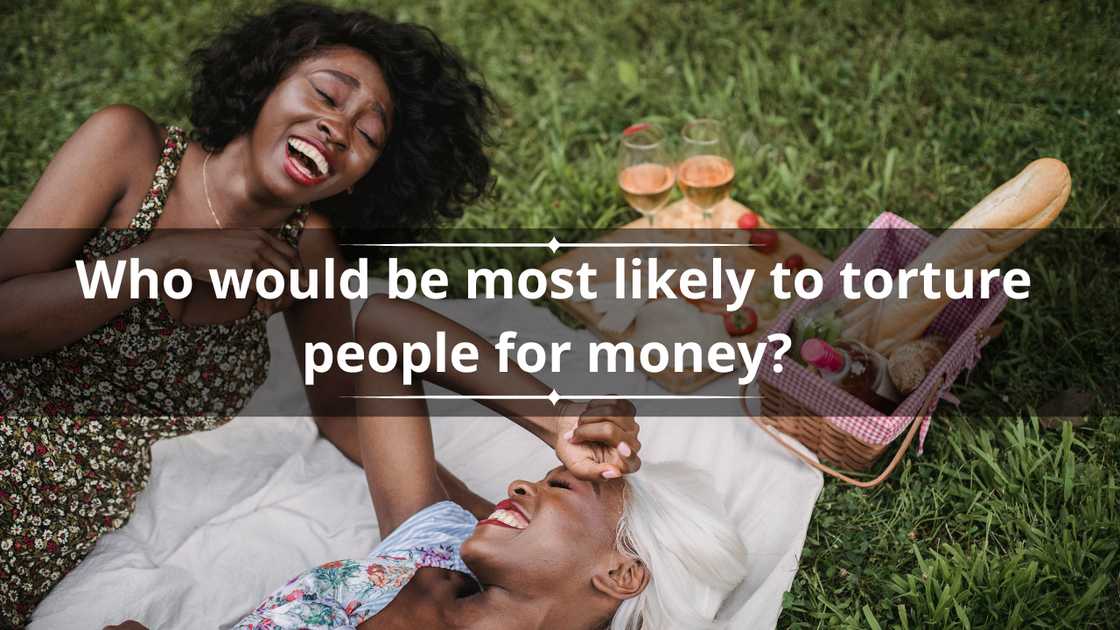 Two women share a hearty laugh during a picnic