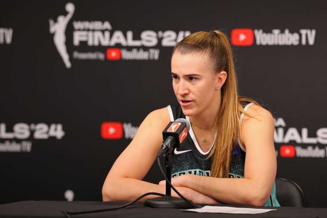 Sabrina Ionescu talks to the media during a press conference