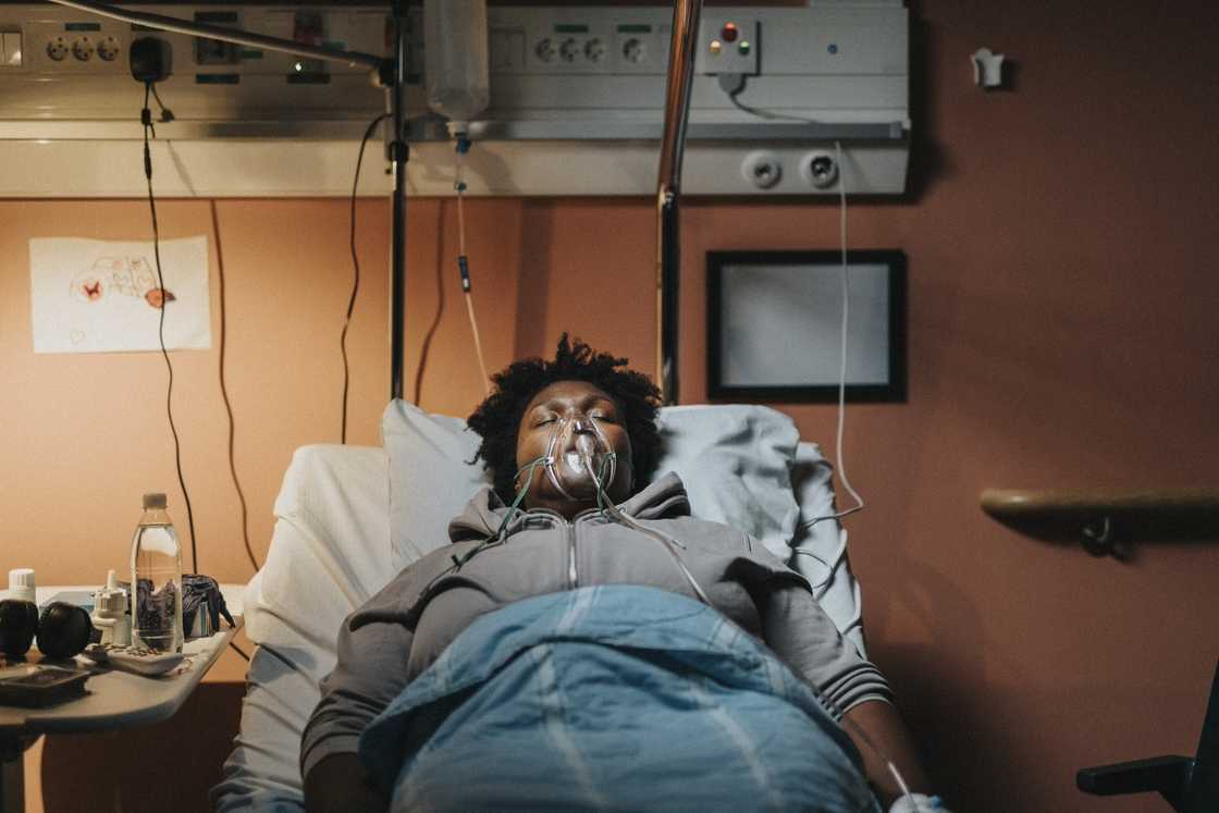 A woman on a hospital bed A woman on a hospital bed