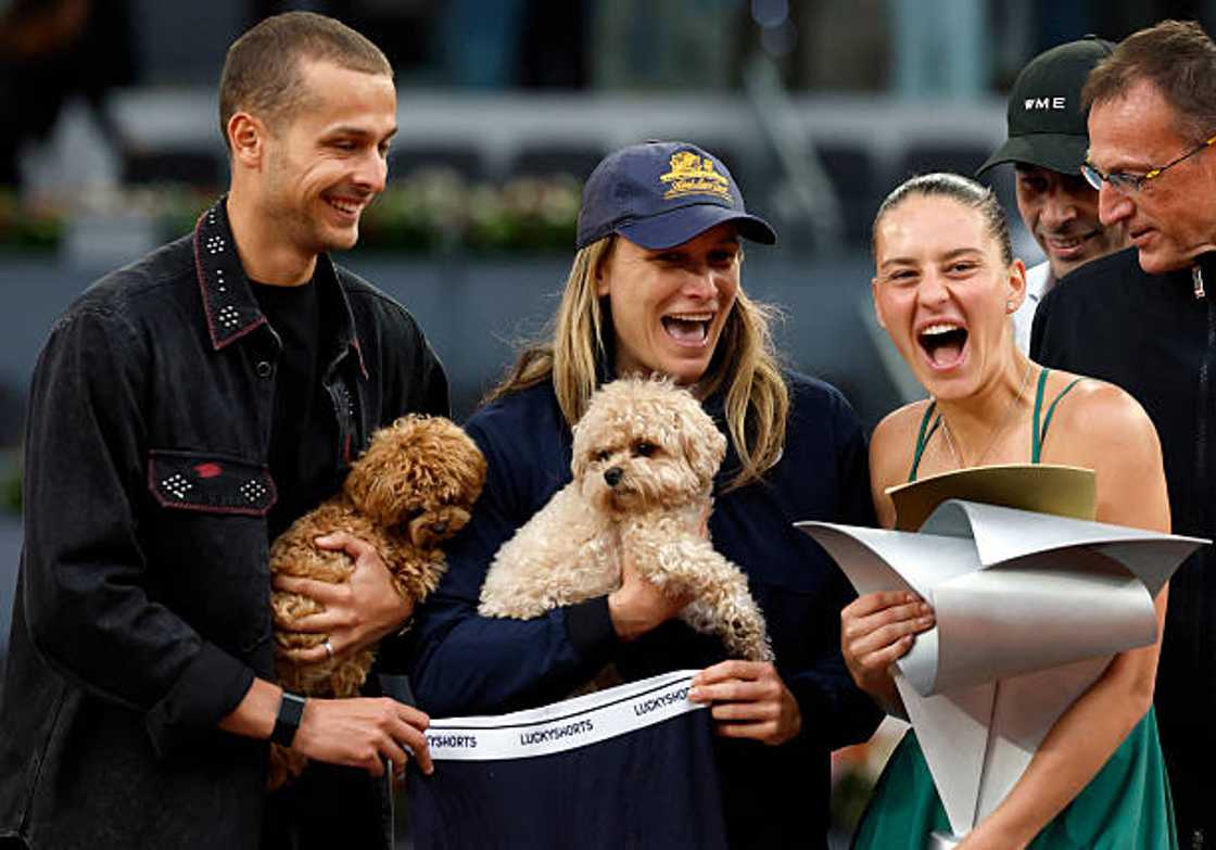 Marta Kostyuk, George Kyzymenko, and her coach Sandra Zaniewska (C) after beating Russia's Mirra Andreeva at the 2026 WTA Tour Madrid Open final singles. Marta Kostyuk, George Kyzymenko, and her coach Sandra Zaniewska (C) after beating Russia's Mirra Andreeva at the 2026 WTA Tour Madrid Open final singles.