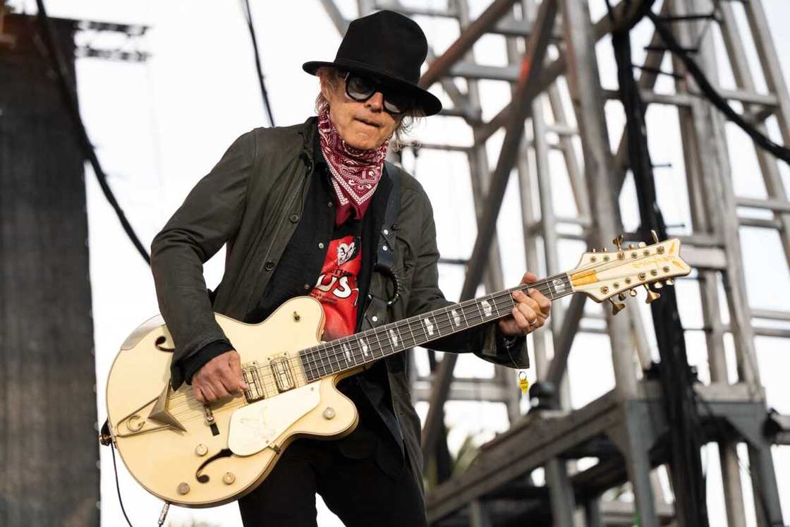 Tom Petersson preforming on stage Tom Petersson preforming on stage