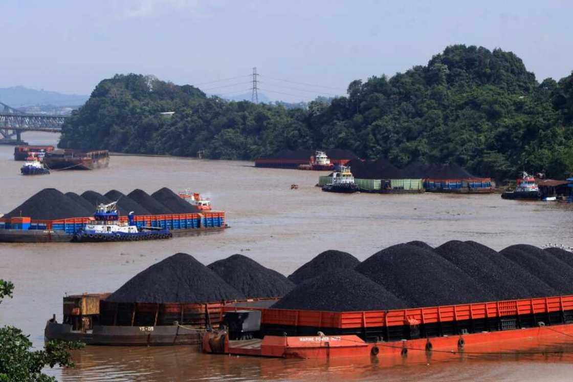 Coal is transported on barges in Samarinda, East Kalimantan, Indonesia on January 11, 2022