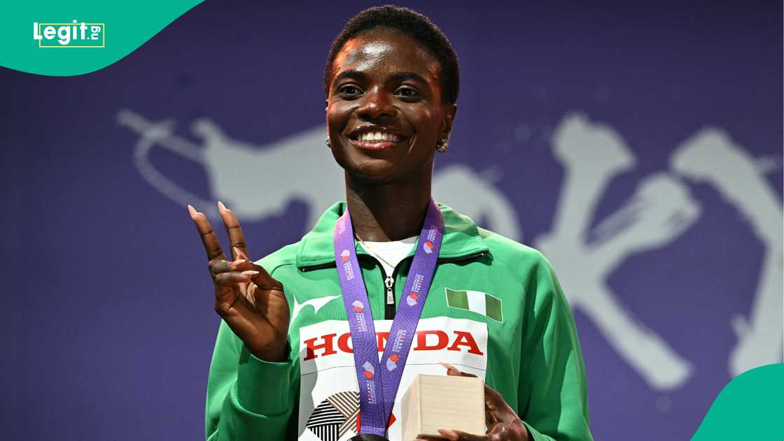 Silver medallist Tobi Amusan poses with her medal at the 2025 World Athletics Championships in Tokyo. Photo by PHILIP FONG