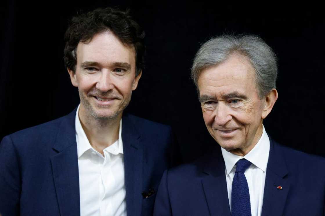 LVMH head Bernard Arnault (R) and his son, CEO of LVMH Holding Company, Antoine Arnault (L)