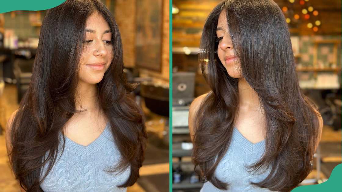 A young woman displays off her face framing layers hairstyle A young woman displays off her face framing layers hairstyle