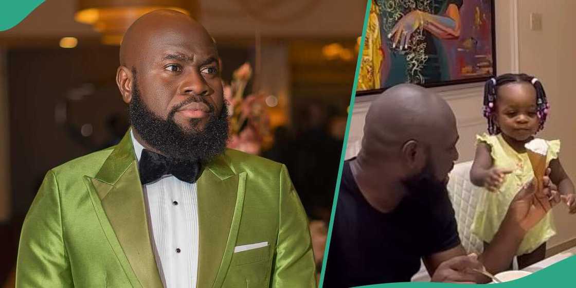 Lasisi Elenu and daughter share ice cream. Lasisi Elenu and daughter share ice cream.