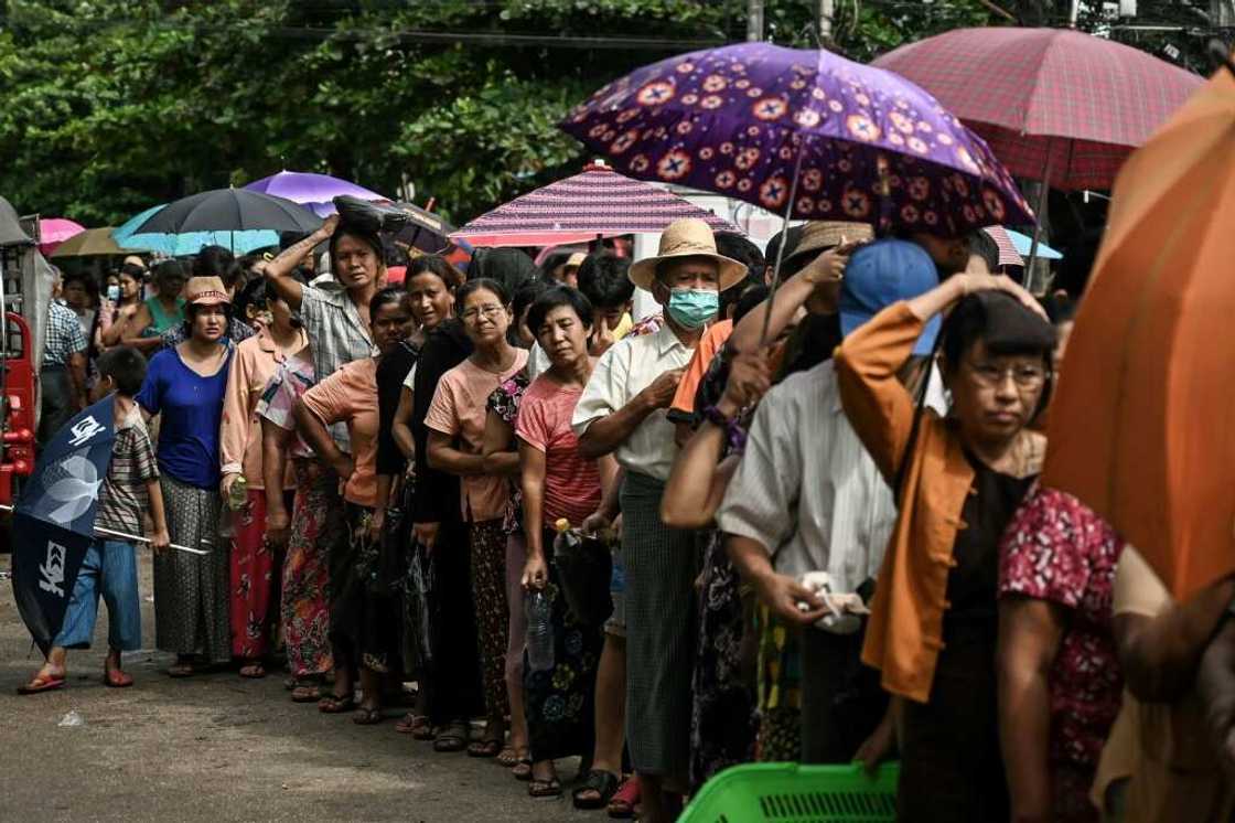 Queues for basic commodities have sprung up in Myanmar's commercial capital Queues for basic commodities have sprung up in Myanmar's commercial capital