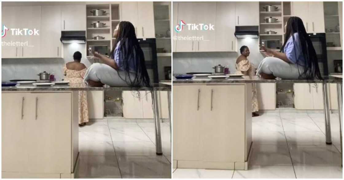 Cooks, lady gists as mum cooks in kitchen Cooks, lady gists as mum cooks in kitchen