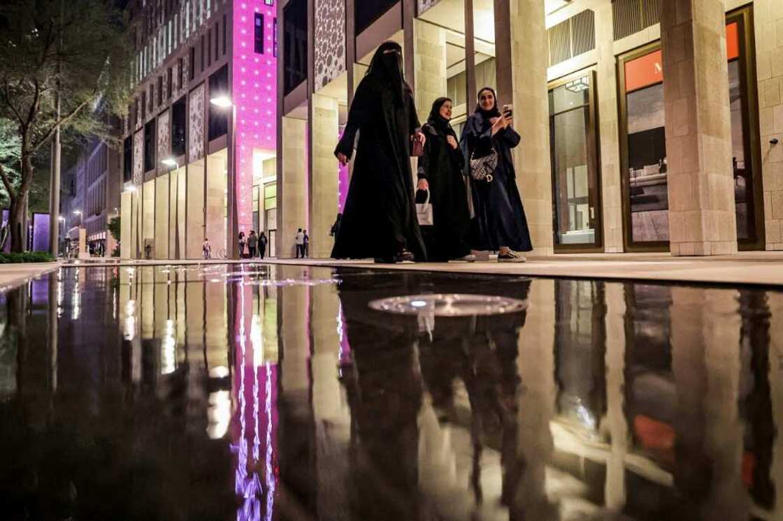 While the Muslim veil is not compulsory in Qatar, women must dress 'modestly', covered from the shoulders to knees While the Muslim veil is not compulsory in Qatar, women must dress 'modestly', covered from the shoulders to knees