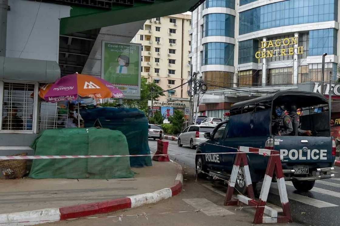 Security forces at a checkpoint in Yangon. Myanmar has been plunged into turmoil since a February 2021 coup which ousted Aung San Suu Kyi's government Security forces at a checkpoint in Yangon. Myanmar has been plunged into turmoil since a February 2021 coup which ousted Aung San Suu Kyi's government