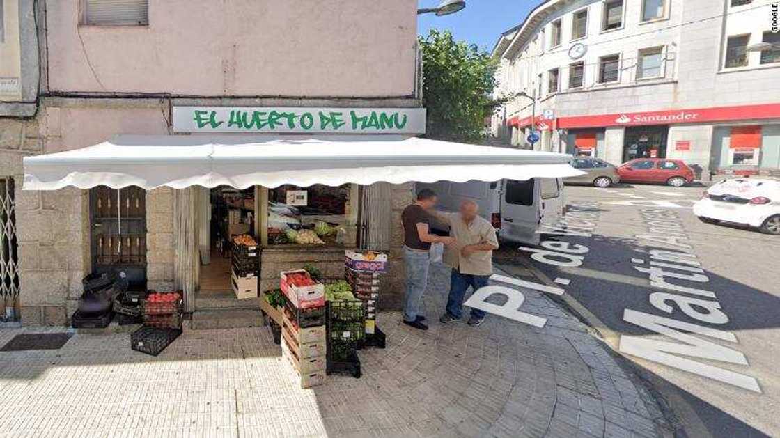 Gammino standing in front of a fruit shop