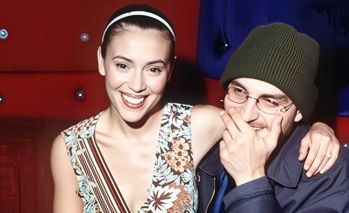 Alyssa Milano and Cinjun August Tate hold each other. Alyssa Milano and Cinjun August Tate hold each other.