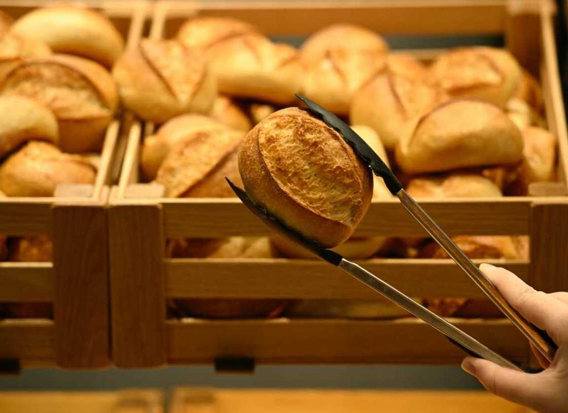 Hundreds of German bakeries served customers in the dark for a day to draw attention to their plight