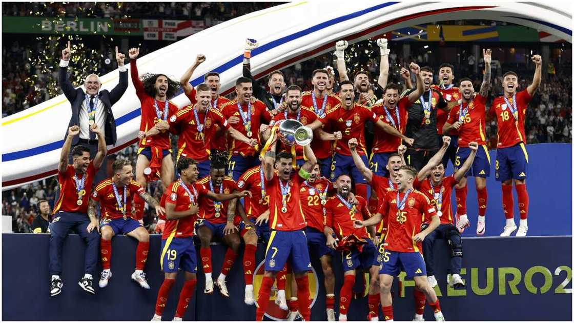 Spain players celebrate with the Euro 2024 trophy. Spain players celebrate with the Euro 2024 trophy.