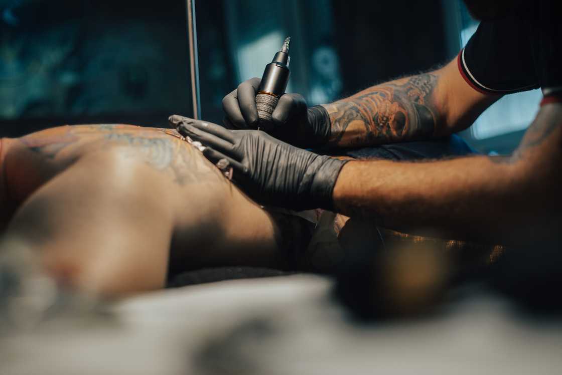 A man getting a tattoo. A man getting a tattoo.