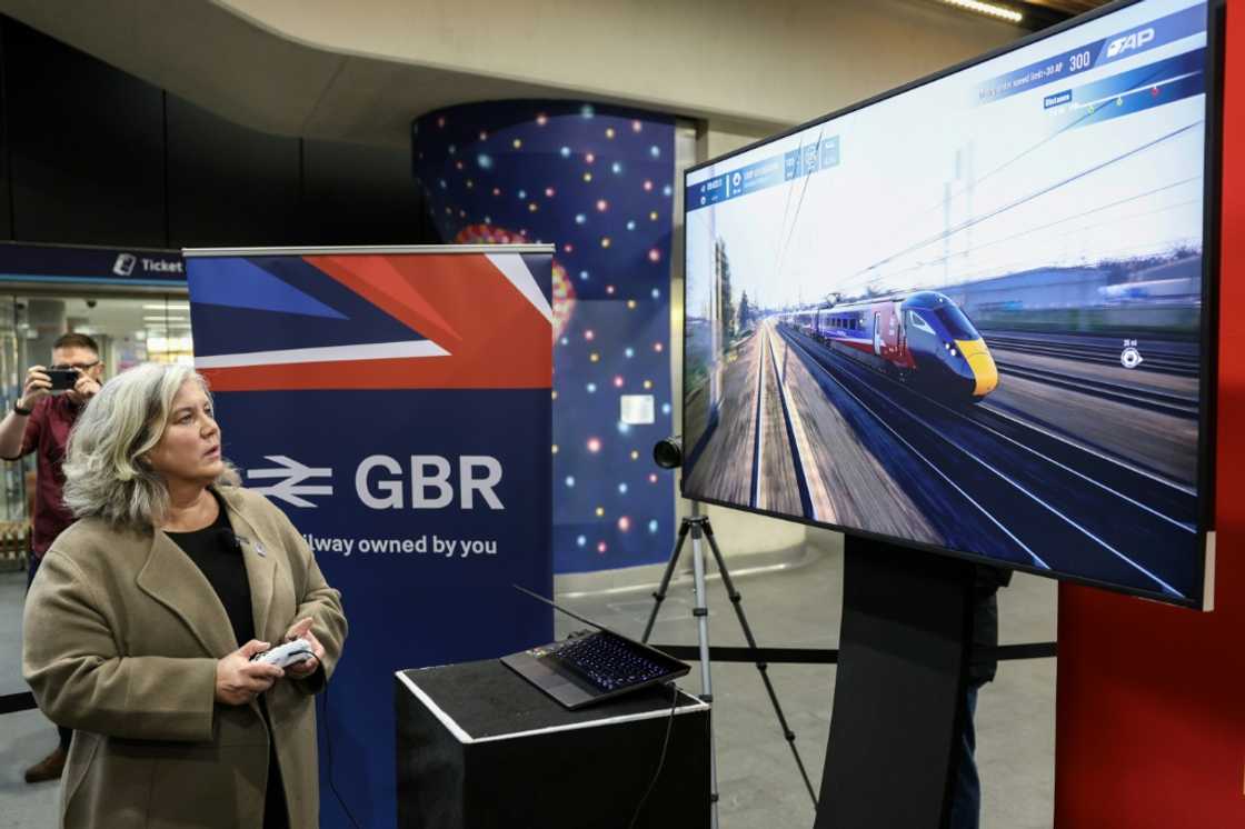 Britain's Transport Secretary Heidi Alexander watches a video game using a train with the new GBR design, during the launch of the Great British Railways (GBR) brand Britain's Transport Secretary Heidi Alexander watches a video game using a train with the new GBR design, during the launch of the Great British Railways (GBR) brand