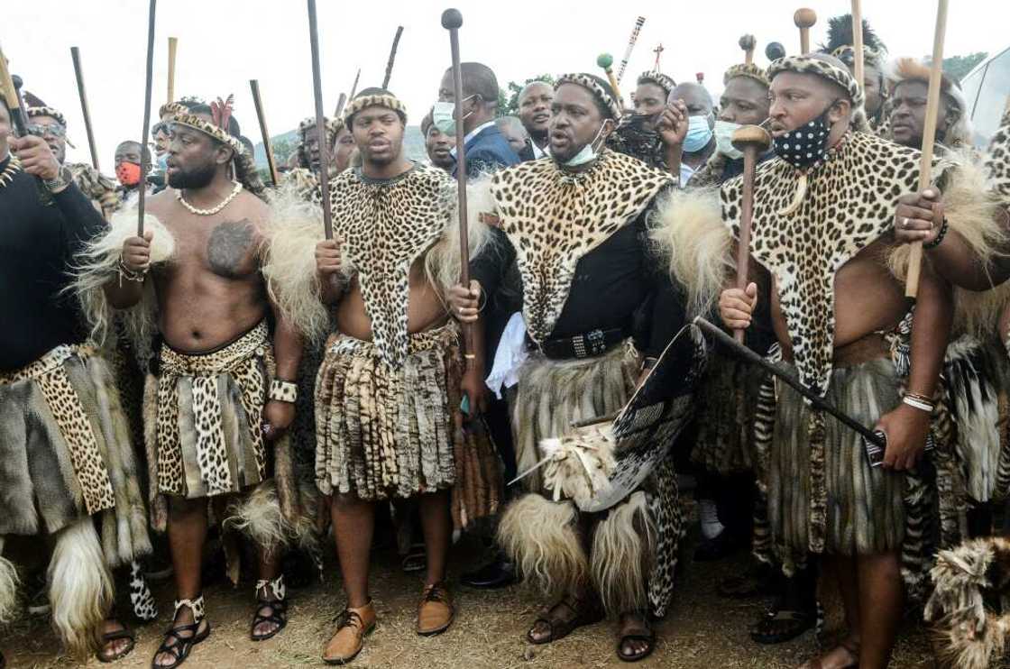 Future king: Prince Misuzulu, second right, arrives with Zulu warriors for the memorial service in May 2021 of his mother, Queen Shiyiwe Mantfombi Dlamini Future king: Prince Misuzulu, second right, arrives with Zulu warriors for the memorial service in May 2021 of his mother, Queen Shiyiwe Mantfombi Dlamini