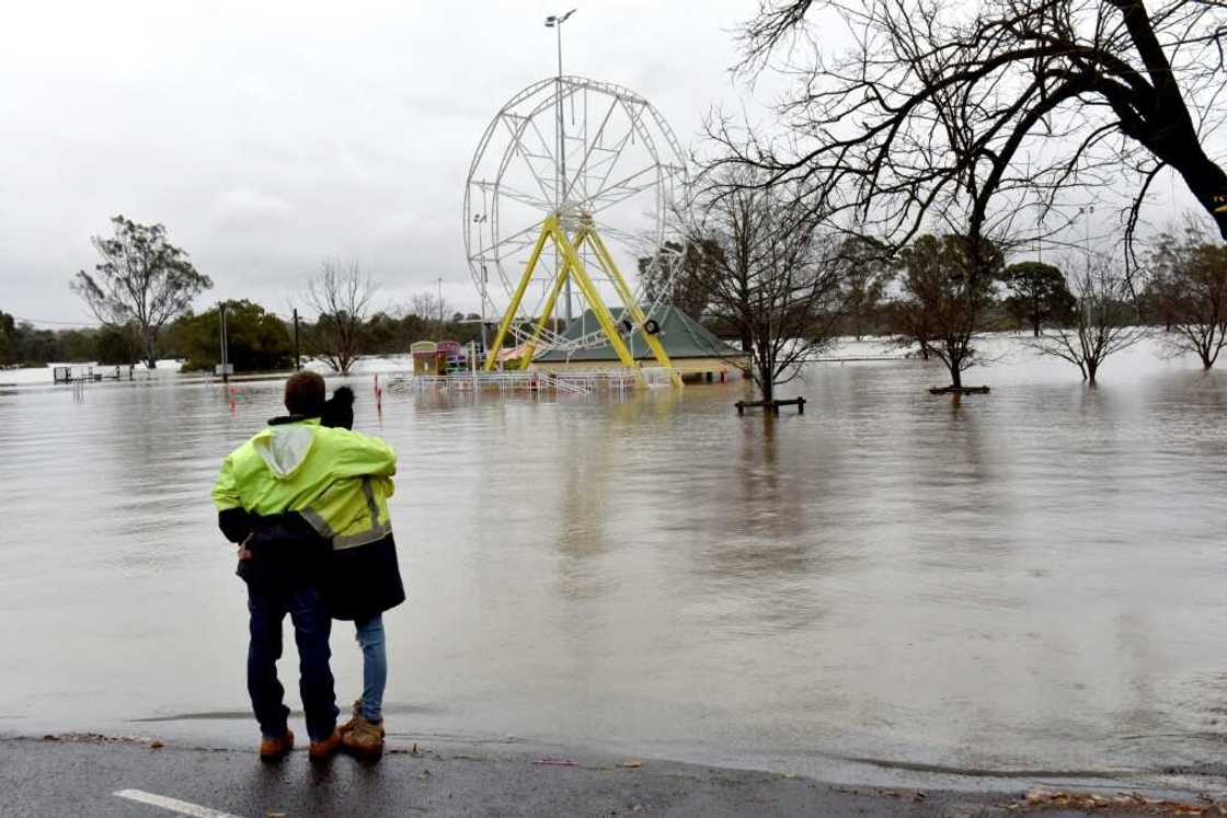 Thousands of Australians were ordered to evacuate their homes in Sydney as torrential rains battered the city