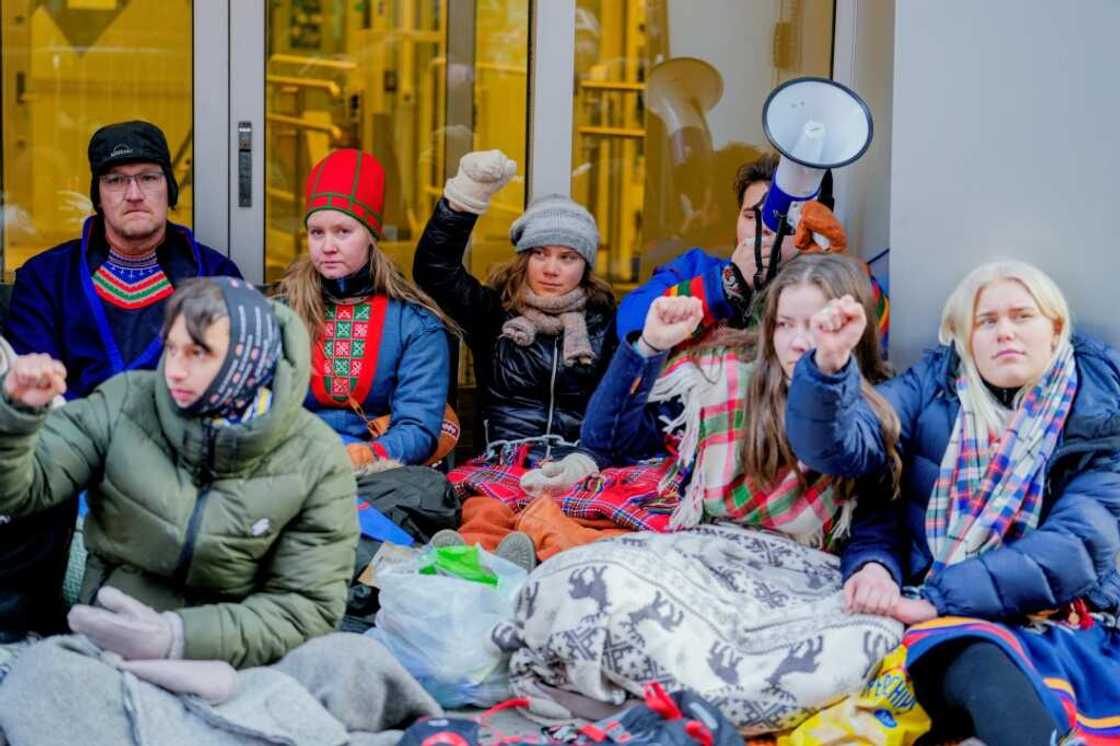 Climate activist Greta Thunberg (C) was among the protesters