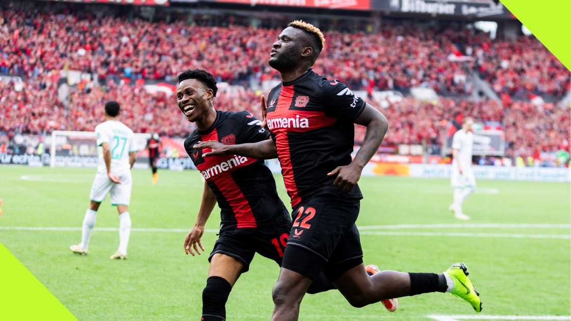 Nathan Tella and Victor Boniface celebrating a Bayer Leverkusen goal.