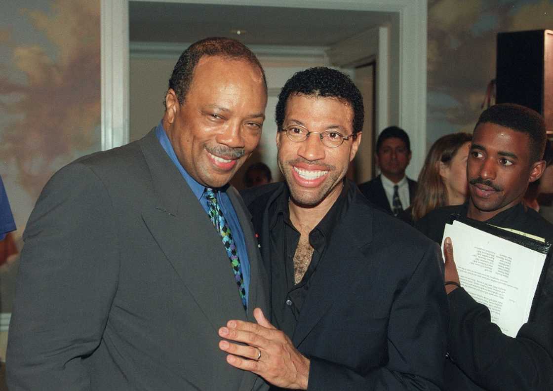 Jones (L) and singer Lionel Richie (R) are seen in Beverly Hills in 1998