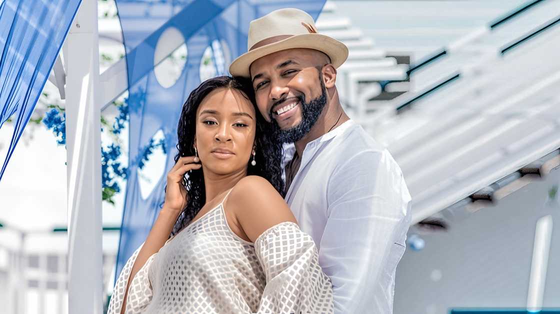 Banky W and Adesua Etomi-Wellington hold each other during a maternity shoot.