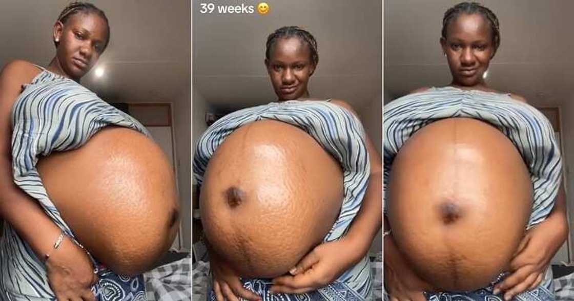 Nigerian woman displays her huge baby bump Nigerian woman displays her huge baby bump