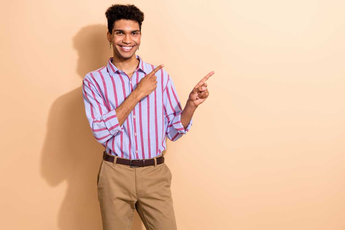 A man dressed in a stylish striped formalwear shirt.