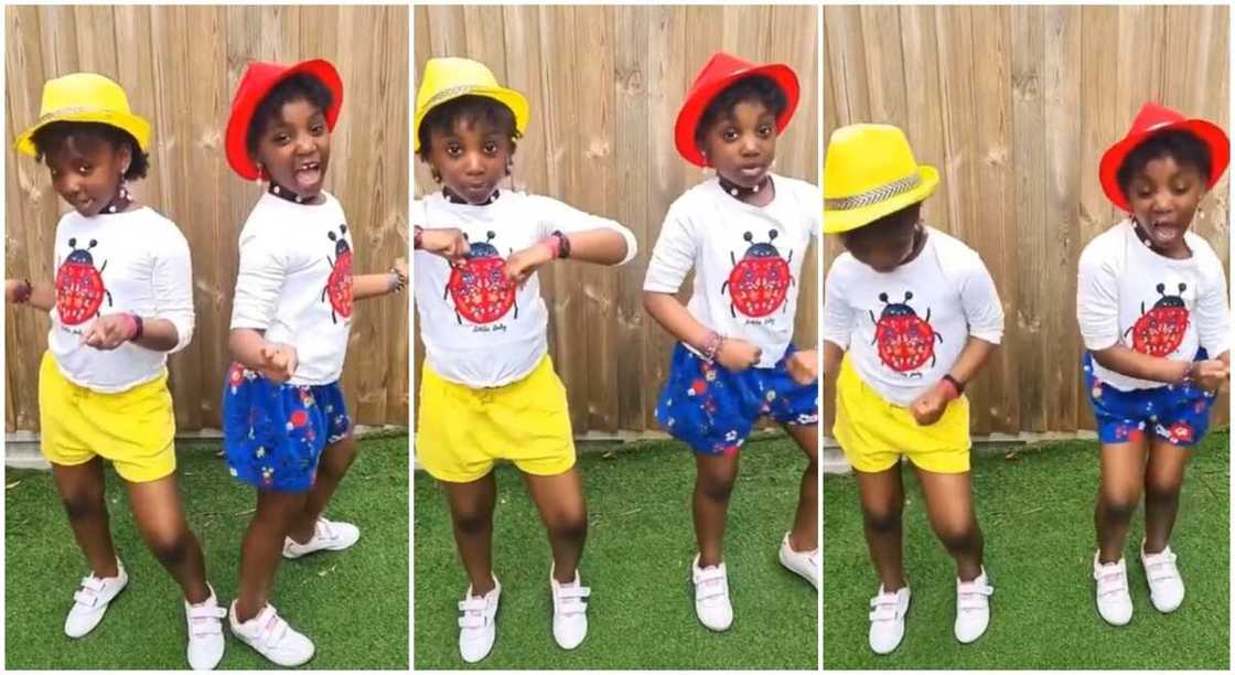 Photos of Nigerian twin girls dancing to Buga by Kizz Daniel and Tecno.