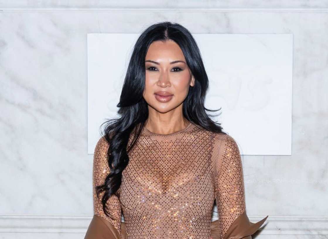 Tracy Romulus in a brown mesh dress poses at the Skims New York Tracy Romulus in a brown mesh dress poses at the Skims New York