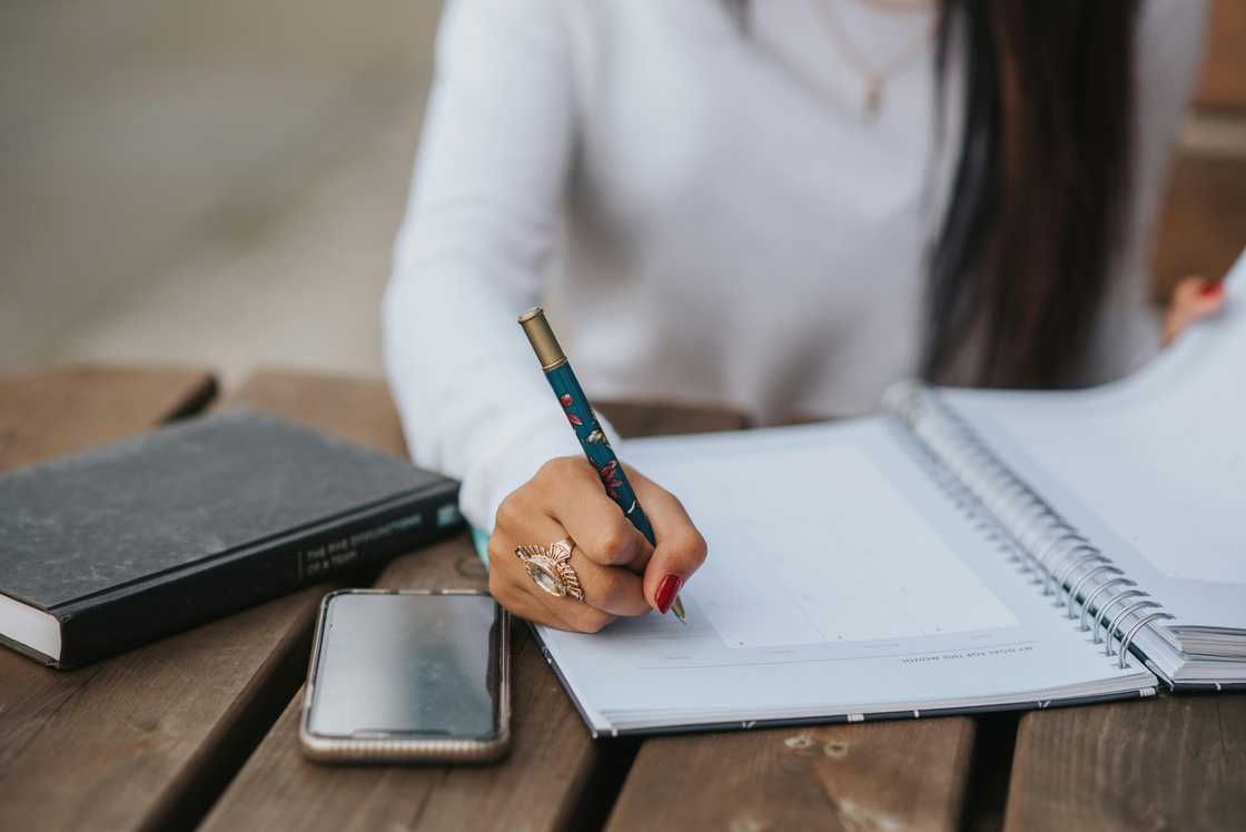 A woman journaling A woman journaling