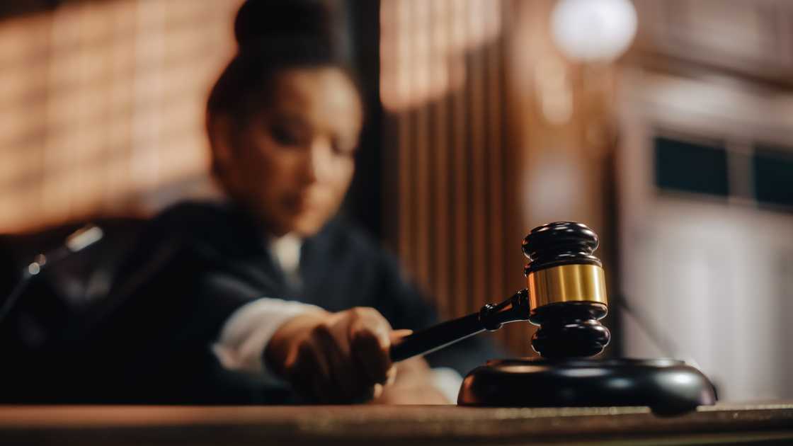 An honourable female judge pronouncing a sentence.