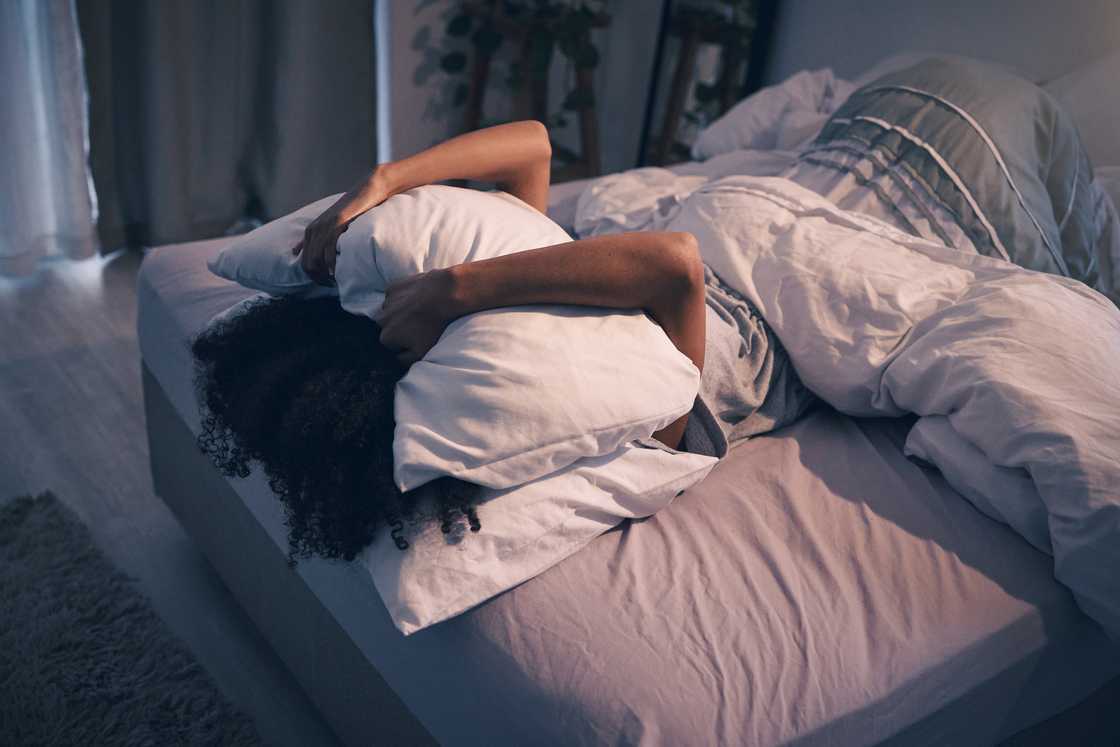 A woman crying in bed A woman crying in bed